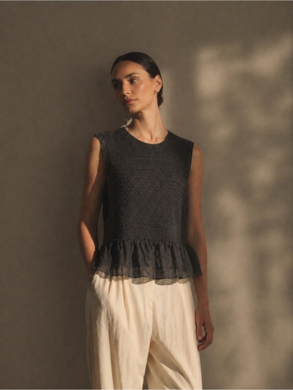 Flannel black silk blend textured knit peplum tank
